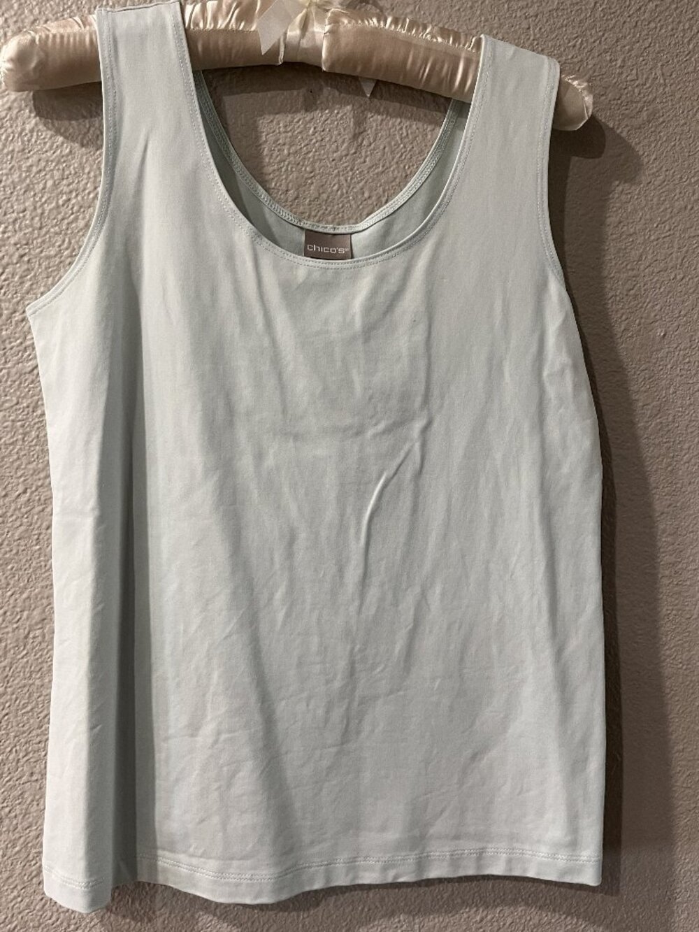 Chico's pale blue tank top.